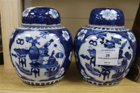 A pair of Chinese blue and white jars and covers